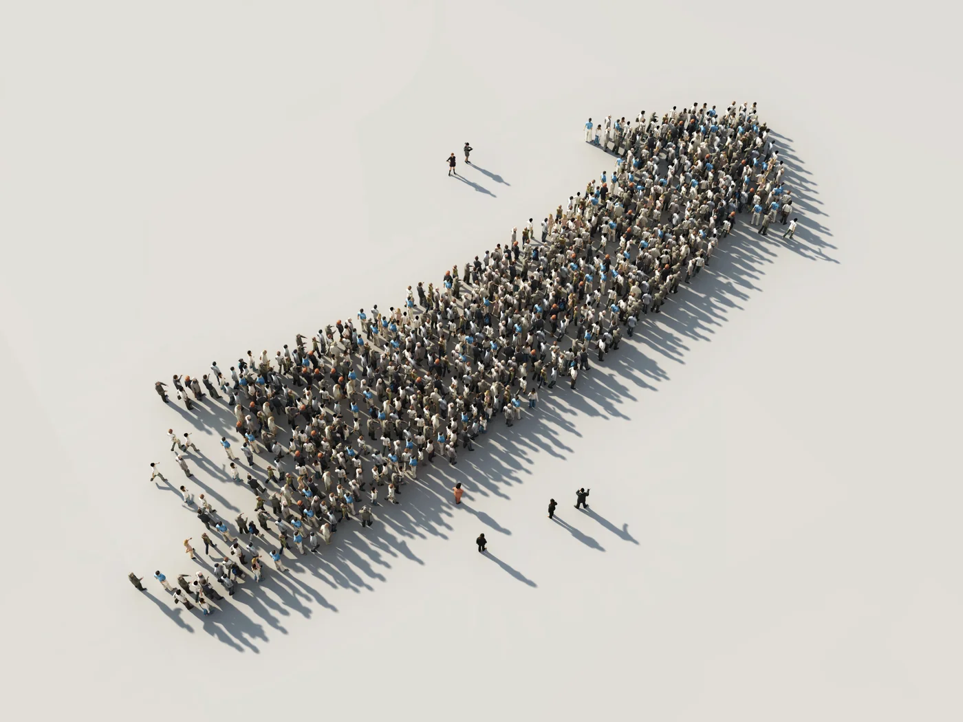 People forming an arrow shape, moving forward together