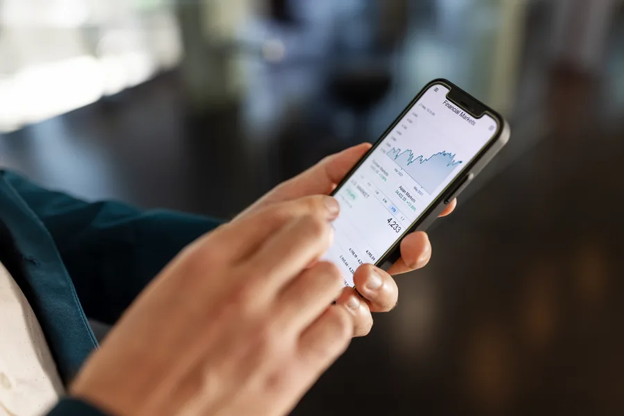 HabitBuck app on a smartphone showing savings growth chart