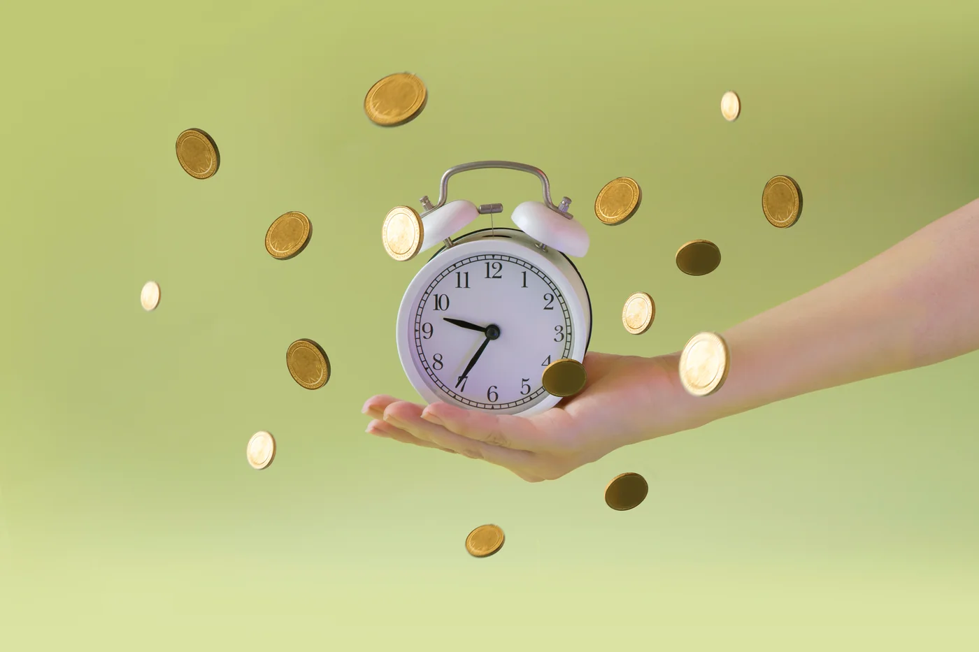 Hand holding a clock surrounded by coins representing financial progress